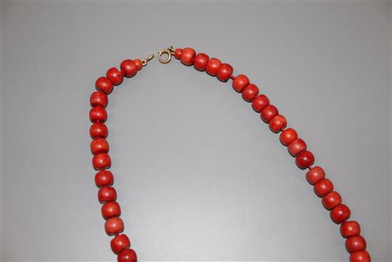 A single strand coral bead necklace, with gilt metal clasp, 47cm, gross weight 64 grams.